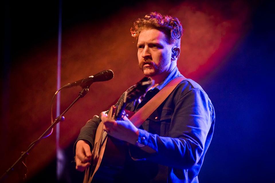 <p>Frank Hoensch/Redferns</p> Tyler Childers performing in January 2020 in Berlin.