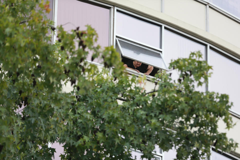 Police responded to a report of gunfire in the lobby at Smith Tower Apartments in downtown Vancouver, Wash., on Thursday, Oct. 3, 2019. Police say a man suspected of shooting several people at the apartment building for the elderly has been taken into custody. (Mark Graves/The Oregonian via AP)