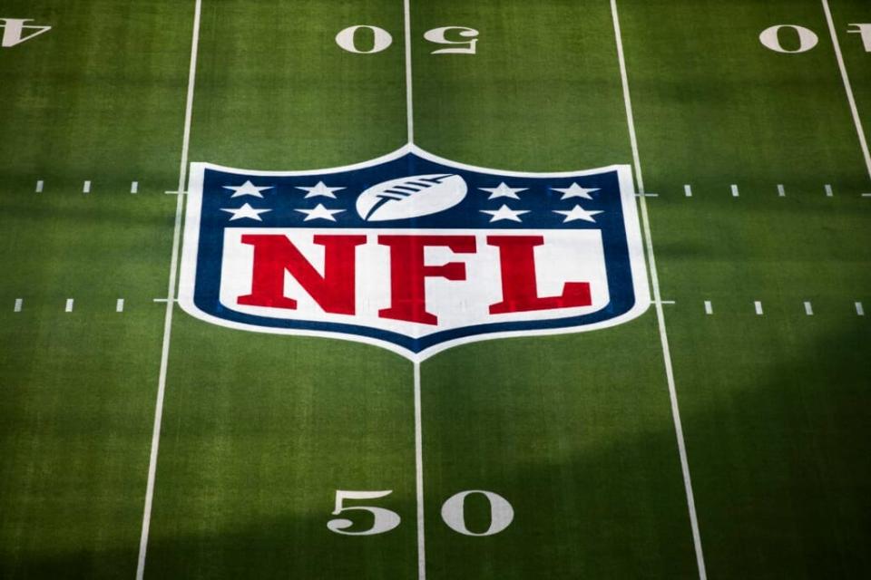 The National Football League logo appears on the 50 yard line for NFL Super Bowl 56 in Inglewood, Calif., Sunday, Feb. 13, 2022. The NFL is telling a judge there are multiple reasons why a lawsuit brought against it by three Black coaches who allege racist hiring practices should fail. (AP Photo/Kyusung Gong, File)