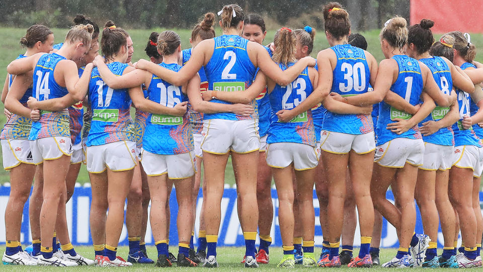 Suns players, pictured here huddling after their loss to Greater Western Sydney Giants in the AFLW.