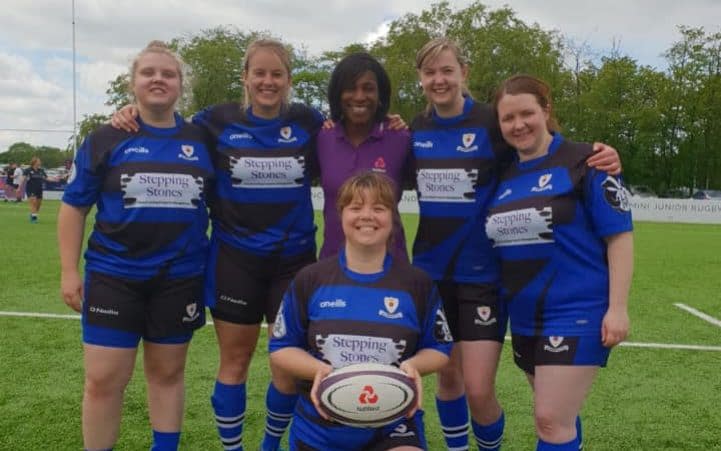 Members of Glossop Amazones RUFC with former England flanker Maggie Alphonsi. Alex Gradwell-Spencer kneels with the ball. From left to right: Gabi McGregor, Katie Haley, Alex Gradwell-Spencer, Emily Scouler and Laura Edwards