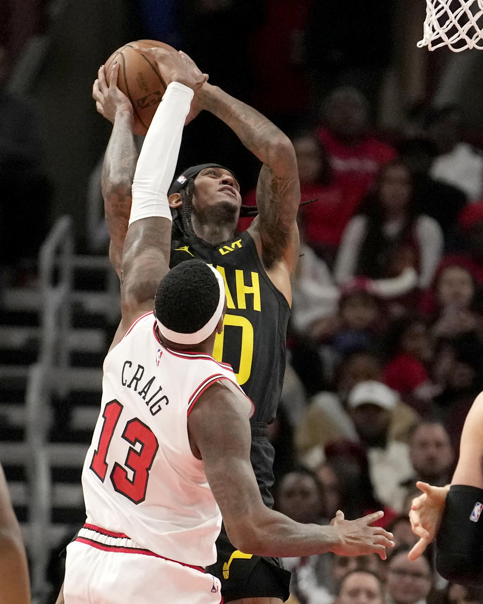 Chicago Bulls' Torrey Craig blocks the shot of Utah Jazz's Jordan Clarkson during the first half of an NBA basketball game Monday, Nov. 6, 2023, in Chicago. (AP Photo/Charles Rex Arbogast)