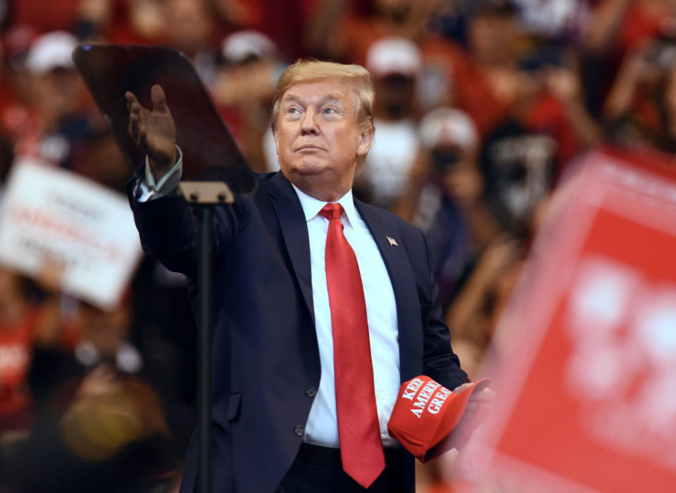 SUNRISE, FLORIDA, UNITED STATES - 2019/11/26: U.S. President Donald Trump throws Keep America Great hats into the crowd before speaking at a Florida Homecoming rally at the BB&T Center. Trump recently became an official resident of the state of Florida. (Photo by Paul Hennessy/SOPA Images/LightRocket via Getty Images)