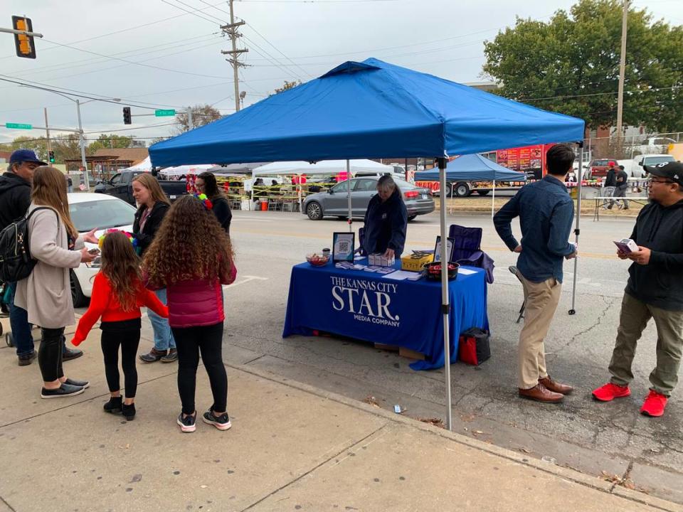 Star staff distribute free naloxone, a medicine that reverses opioid overdoses, and resource guides alongside partners from DCCCA at the Dia de Muertos festival along Central Avenue in Kansas City, Kansas.