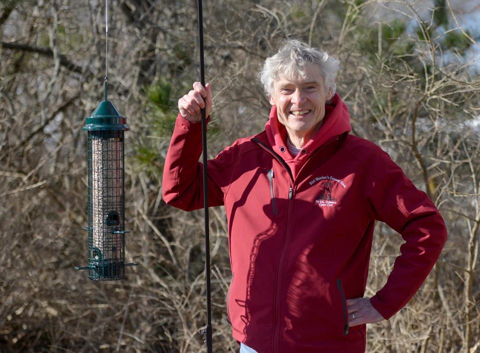 Mike O'Connor, owner of the Bird Watcher's General Store in Orleans, hanging around with his favorite bird feeder, the Brome Squirrel Buster Classic.