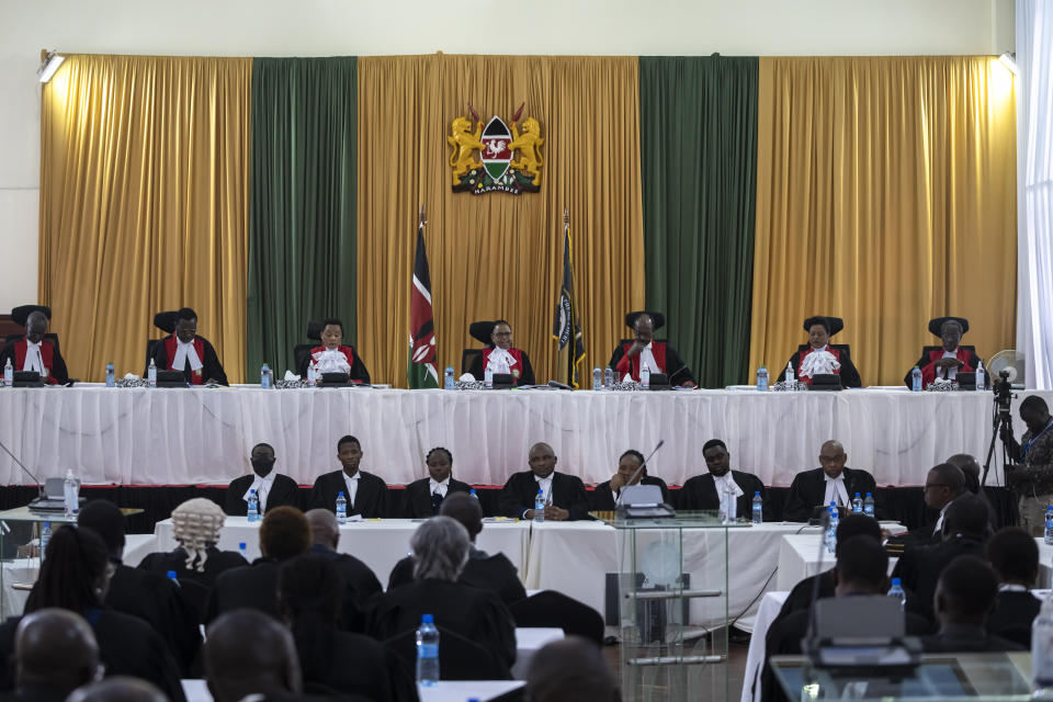 From left to right, Kenya's Supreme Court judges Isaac Lenaola, Smokin Wanjala, Deputy Chief Justice Philomena Mbete Mwilu, Chief Justice Martha Koome, Mohammed Khadhar Ibrahim, Njoki Susanna Ndung'u, and William Ouko, deliver judgement in the electoral petition at the Supreme Court in Nairobi, Kenya Monday, Sept. 5, 2022. Kenya's Supreme Court on Monday is ruling on challenges to the presidential election in which Deputy President William Ruto was declared the winner by a slim margin and opposition candidate Raila Odinga alleged irregularities in the otherwise peaceful Aug. 9 election. (AP Photo/Ben Curtis)