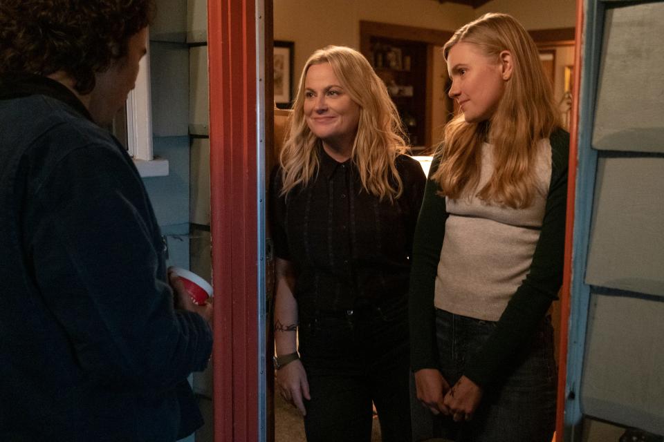 Vivian (Hadley Robinson, far right) is inspired to start a revolution at her high school by her mom (Amy Poehler, who also directs) in "Moxie."