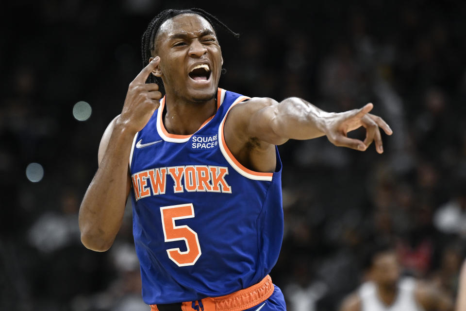 New York Knicks' Immanuel Quickley celebrates a basket during the second half of the team's NBA basketball game against the San Antonio Spurs, Tuesday, Dec. 7, 2021, in San Antonio. The Knicks won 121-109. (AP Photo/Darren Abate)