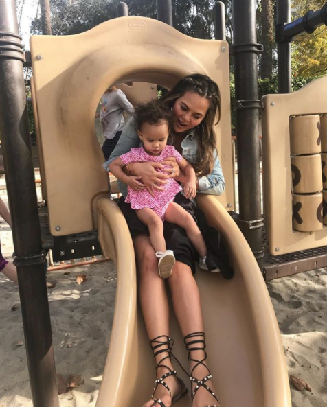 Chrissy was shamed back in January for sliding down a slide with Luna on her lap. Source: Instagram/chrissyteigan