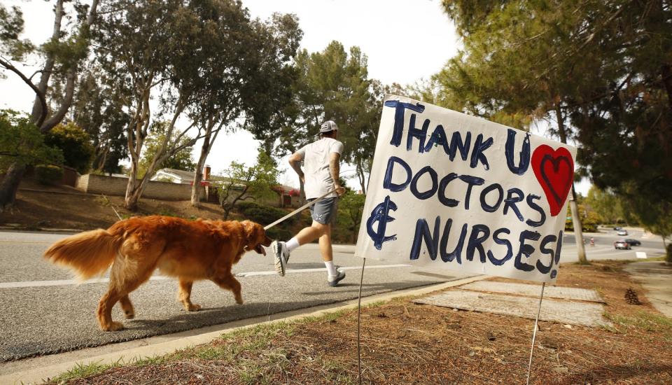 A jogger and his dog on the route to Los Robles Hospital & Medical Center in Thousand Oaks.