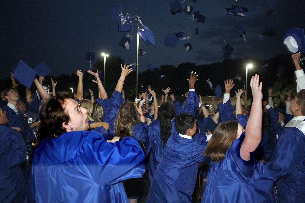 White House High tosses their Mortar Boards after graduating on Thursday, May 19, 2022. 