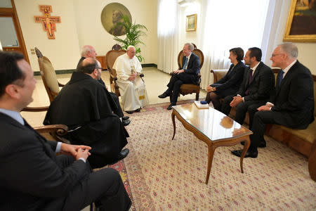 Microsoft President and Chief Legal Officer Brad Smith meets with Pope Francis at Saint Martha's House at the Vatican, February 13, 2019. Vatican Media/Handout via REUTERS