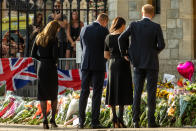 <p>Prince William and Catherine, the new Prince and Princess of Wales, join Prince Harry and Meghan, the Duke and Duchess of Sussex, to view floral tributes to Queen Elizabeth II. (Getty)</p> 