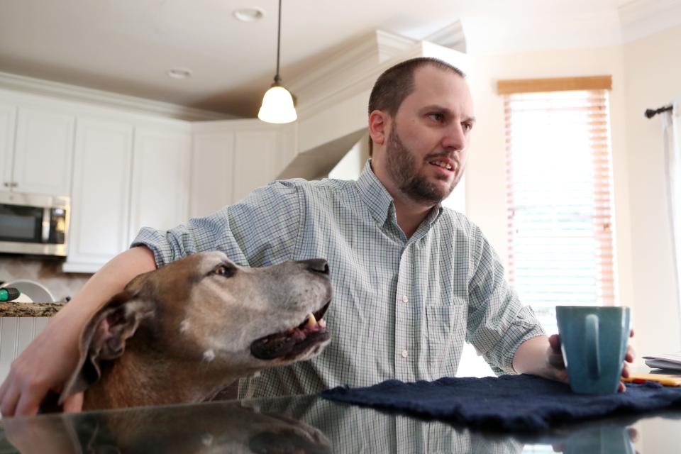 County legislature candidate Dan Branda talks about his home situation while in the kitchen of his Somers home with his dog Phil Oct. 19, 2023.