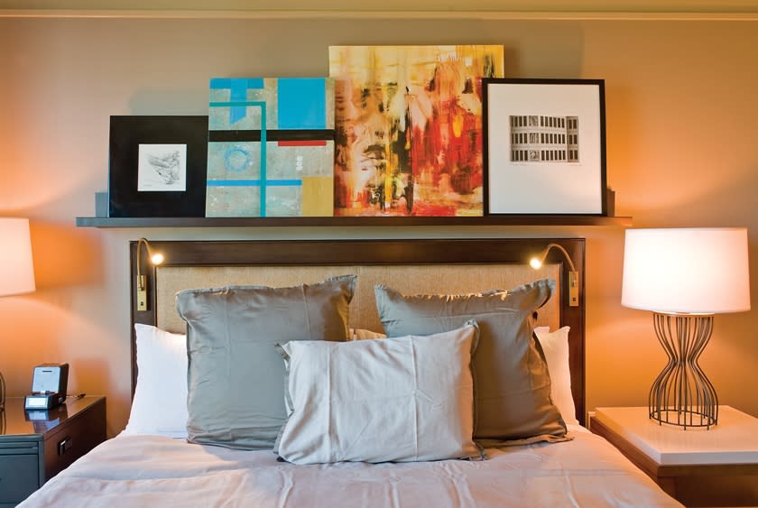 This undated photo supplied by H+K Strategies shows artwork in an Omni Dallas Hotel guest room. Omni is one of a number of hotels that features unusual art in the rooms and allows guests the option of purchasing the work to take home. For several years, hotels have invited local artists in to decorate hallways, lobbies and other public spaces. It’s a way they can distinguish themselves from the cookie-cutter chains and offer guests a sense of their unique city or town. Now, they are taking that partnership one step further and turning bedrooms into mini-salesrooms. (AP Photo/Omni Dallas Hotel, Jeremy McKane)