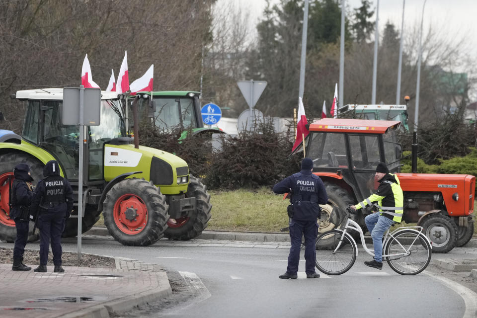 Polish farmers drive tractors in a convoy as they intensify a nationwide protest against the import of Ukrainian foods and European Union environmental policies, in Minsk Mazowiecki, Poland, on Tuesday Feb. 20, 2024. Farmers across Europe have been protesting recently, worried that EU plans to place limits on the use of chemicals and on greenhouse gas emissions will result in a reduction in production and income. They are also in revolt against competition from non-EU countries, in particular Ukraine. (AP Photo/Czarek Sokolowski)