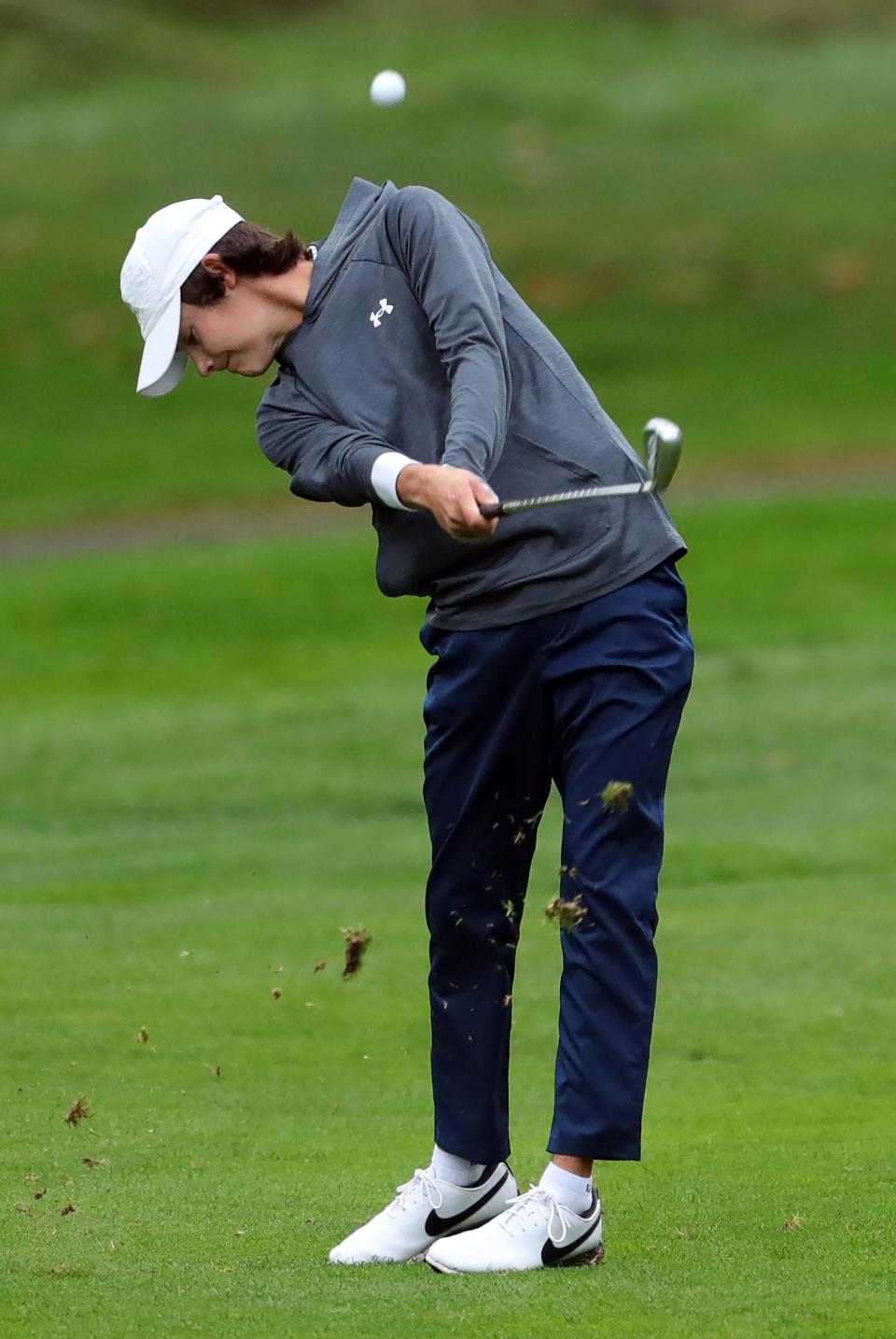 Hudson's Ben Fauver takes his second shot from the No. 16 fairway during the Suburban League golf tournament Thursday at J.E. Good Park Golf Course.