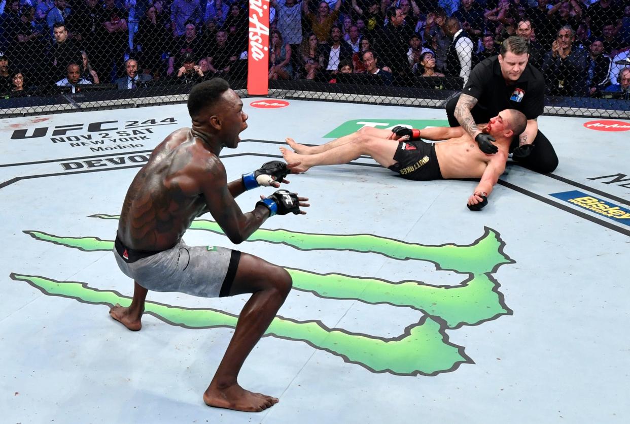 Israel Adesanya celebrates a win over Robert Whittaker, who he fights once again Saturday.