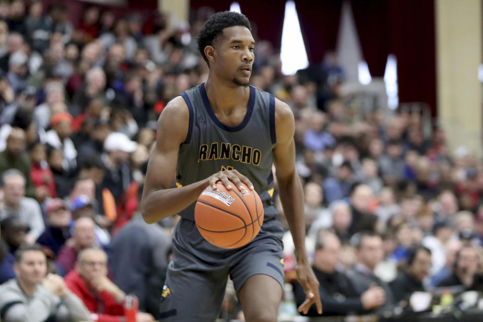 FILE - In this Jan. 20, 2020, file photo, Rancho Christian's Evan Mobley controls the ball against DeMatha during a high school basketball game at the Hoophall Classic in Springfield, Mass. Among the slew of new players on Southern California’s roster, Mobley stands out. He joins the Trojans as one of the nation’s most hyped freshmen and figures to make an immediate impact on a team seeking a breakthrough. (AP Photo/Gregory Payan, File)