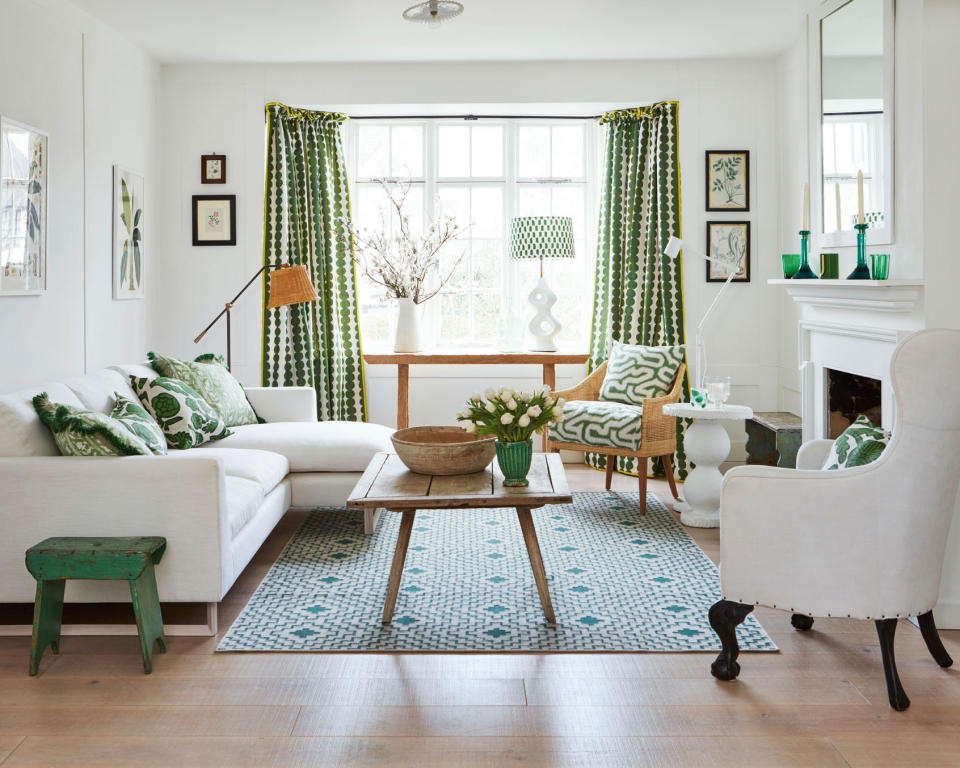 <p> For a contemporary take on classic country decorating ideas, make fresh and vibrant patterns the stars of the show. Combining a variety of prints, all in fresh greens and whites, ensures this room feels calm and not overwhelming.&#xA0;&#xA0; </p> <p> Here, there is a wonderful mixture of patterned textiles, from the cushions and lampshade, to the curtains and rug underfoot. The clean white space and white pieces of furniture ensure all the green pattern doesn&apos;t dominate. Warm wood, brought in through the coffee table, console and flooring, bring in the essential natural element key to any country scheme.&#xA0; </p>