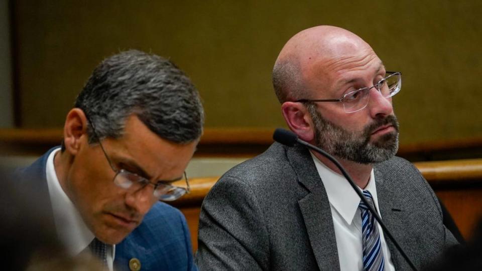 Prosecuting attorneys Eric Dobroth and Ben Blumenthal look on as a witness gives testimony during the trial of Stephen Deflaun on April 11. Deflaun is accused of killing San Pedro resident Stephen Wells, 37, and his 11-year-old nephew, Jerry Rios Jr., during an altercation over a camping spot at Morro Strand State Beach on July 8, 2001.