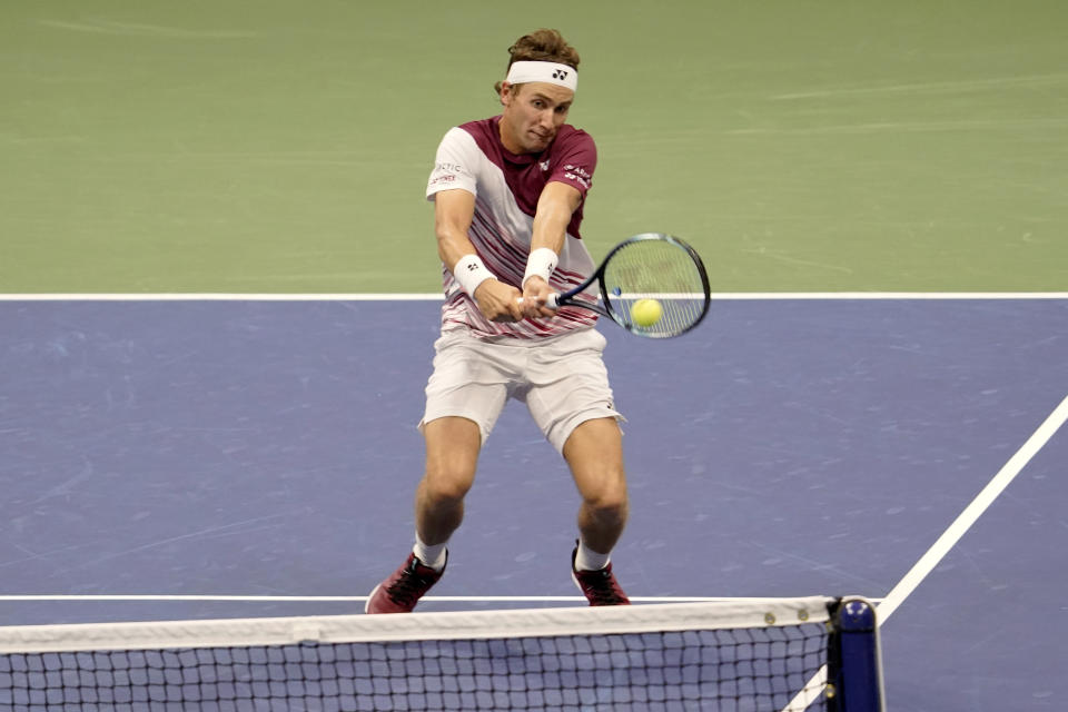 Casper Ruud, of Norway, returns a shot to Carlos Alcaraz, of Spain, during the men's singles final of the U.S. Open tennis championships, Sunday, Sept. 11, 2022, in New York. (AP Photo/Mary Altaffer)