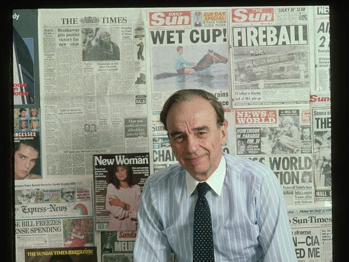 Publishing magnate Rupert Murdoch with sample newspapers and magazines put out by his international conglomerate at the offices of the New York Post.