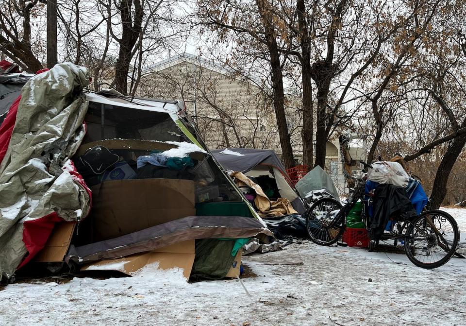 Police and city workers arrived at an encampment in the area of 101A Avenue and 95th Street on Tuesday, January 9, 2024.