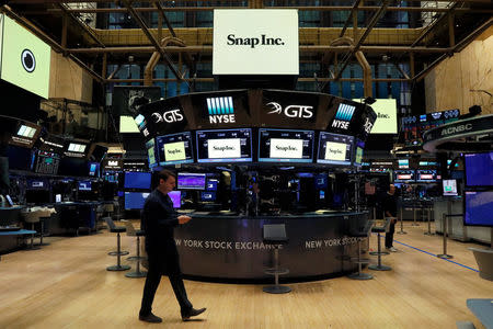 Snap Inc. logos are seen on the floor of the New York Stock Exchange (NYSE) on the eve of the company's IPO in New York, U.S., March 1, 2017. REUTERS/Brendan McDermid