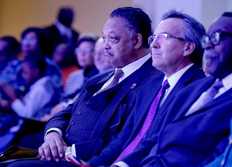 (Middle) Rev. Jesse Jackson listens to speakers before he was to give the keynote address during the Let Freedom Ring event in the atrium at Cobo Center in downtown Detroit on Monday, Jan. 15, 2018.