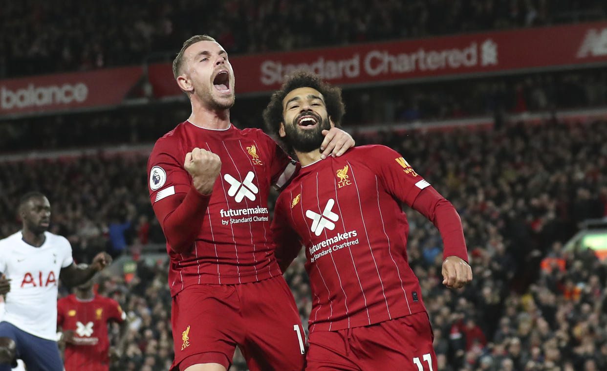 Mohamed Salah (right) and Jordan Henderson scored the goals as Liverpool rallied to beat Tottenham at Anfield. (AP)