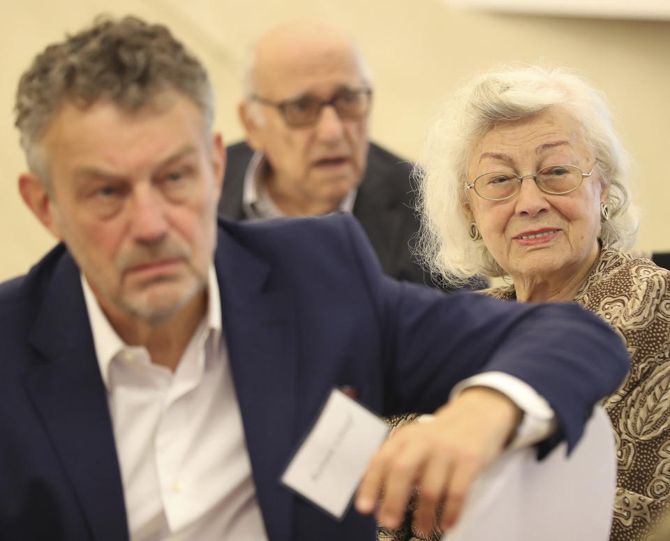 Alicja Schnepf, right, a Polish woman who helped to rescue Jews during the Holocaust, sits with her son, Ryszard Schnepf, a former Polish ambassador to the United States and Spain, during an event to honor Polish people who saved Jews during WWII, in Warsaw, Poland, Sunday, Sept. 8, 2019. A U.S.-based Jewish foundation held an event in Warsaw on Sunday to honor Polish gentiles who rescued Jews during the Holocaust, a number that grows smaller each year, with U.S. and Israeli diplomats also paying their respects to the elderly Poles who put their lives in danger to save others. (AP Photo/Czarek Sokolowski)