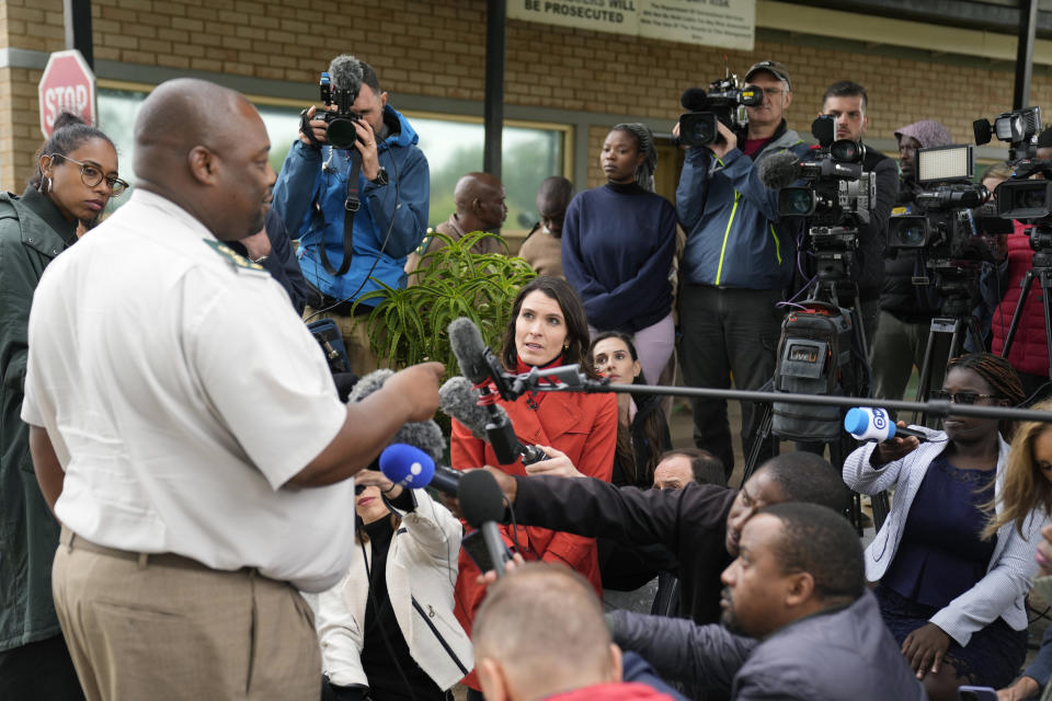 Department of Justice and Correctional Services spokesman, Singabakho Nxumalo, left, addresses the gathered media outside the Atteridgeville Prison where a parole hearing for Oscar Pistorius is underway, in Pretoria, South Africa, Friday March 31, 2023. The parents of Reeva Steenkamp, the woman Oscar Pistorius shot dead 10 years ago, will oppose the former Olympic runner's application for parole, their lawyer said Friday. (AP Photo/Themba Hadebe)