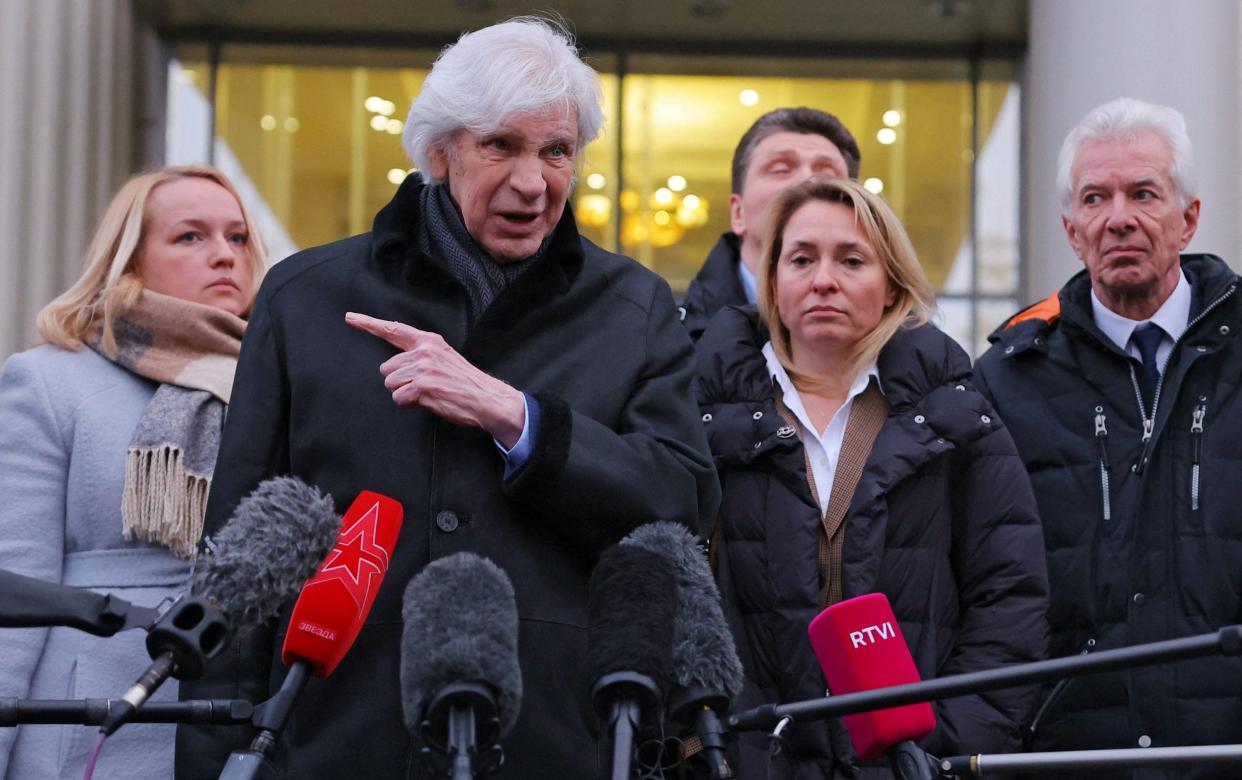 Lawyer Genri Reznik speaks to the media next to members and lawyers of the Moscow Helsinki Group, after a hearing to liquidate it - Reuters/Evgenia Novozhenina