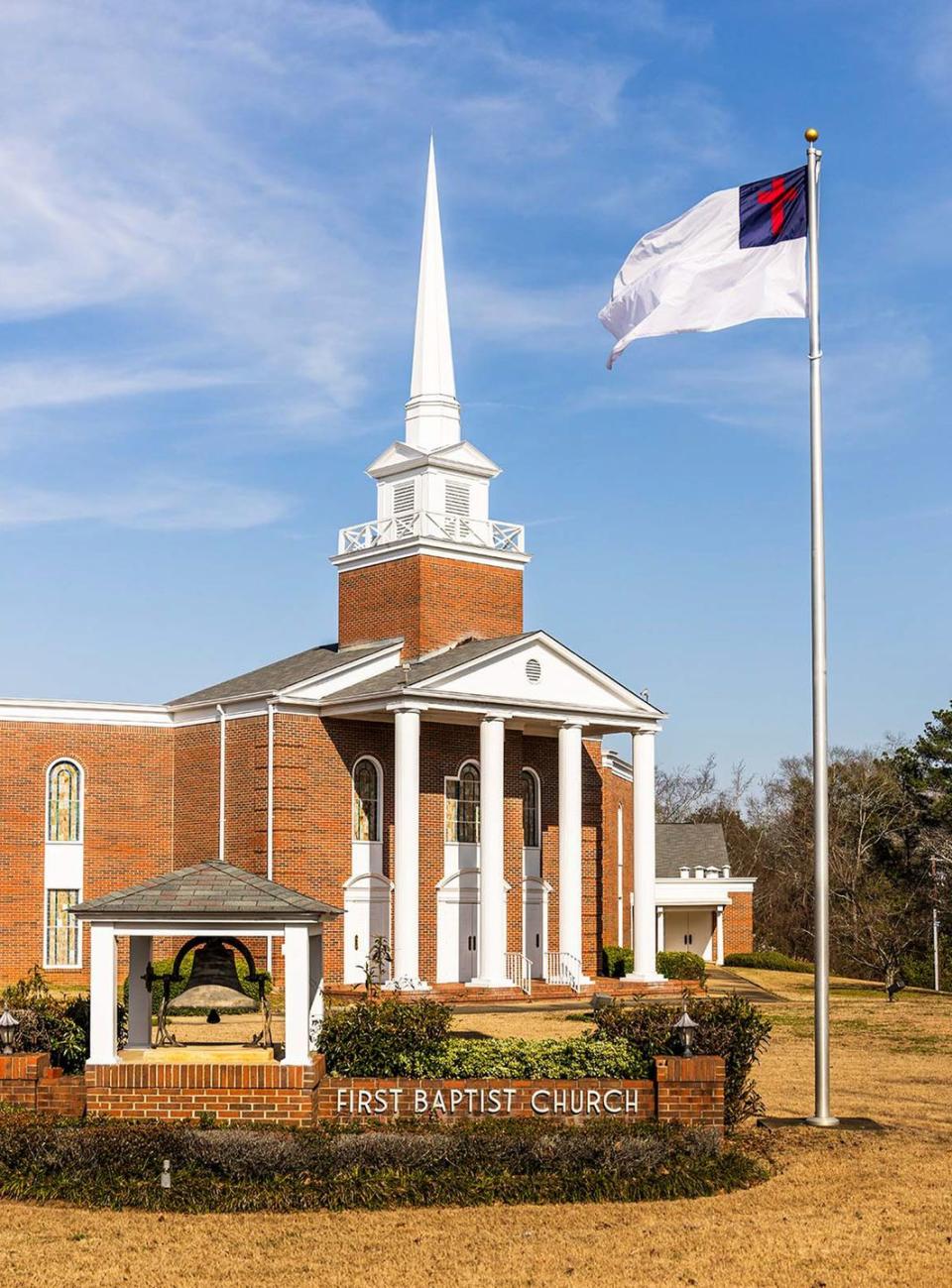 a building with a flag on the roof