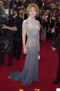 <p> The actress looked unrecognizable (and not in a good way) at the 2001 event, when she stepped out in this gray dress with a fringe neck shawl. I prefer to remember her in the 2014 Atelier Versace look instead. </p>