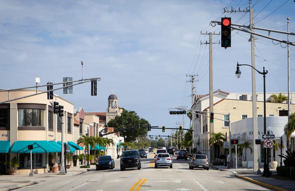 North County Road from Royal Poinciana Way looking north Sunday, March 21, 2021. In the background, to the left, is St. Edward's Catholic Church, built in 1926. In the foreground is the intersection of North County Road and Royal Poinciana Way, which then was known as Flagler Avenue and later as Main Street. BRUCE R. BENNETT