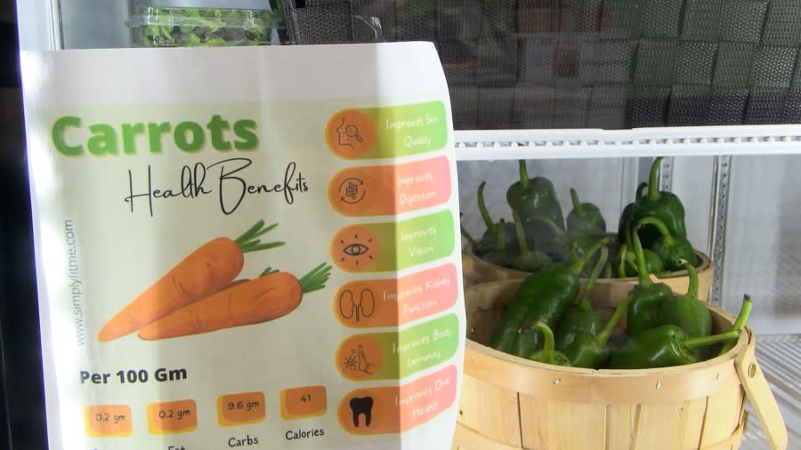 Papers were taped on the front of the refrigerator doors to inform customers of the benefits of several vegetables.