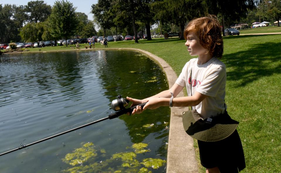 Jonathan Friske, 8, of North Canton spends his last days of summer break fishing at Price Park in North Canton.