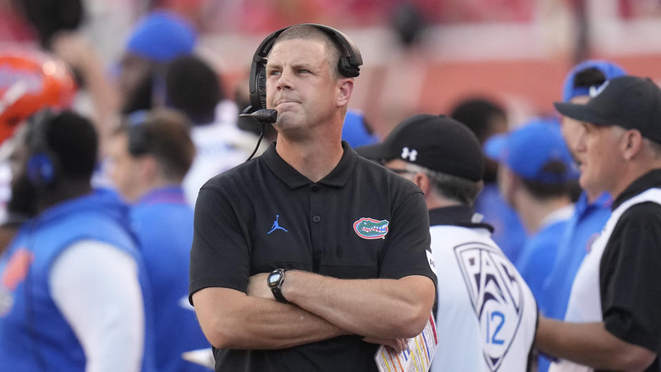 Florida coach Billy Napier looks at the scoreboard during the first half of the team's NCAA college football game against Utah on Thursday, Aug. 31, 2023, in Salt Lake City. (AP Photo/Rick Bowmer)