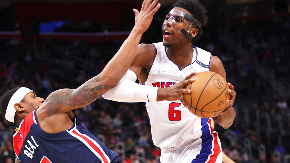 Seen here, Pistons star Hamidou Diallo takes the ball to the basket during a game in the NBA.