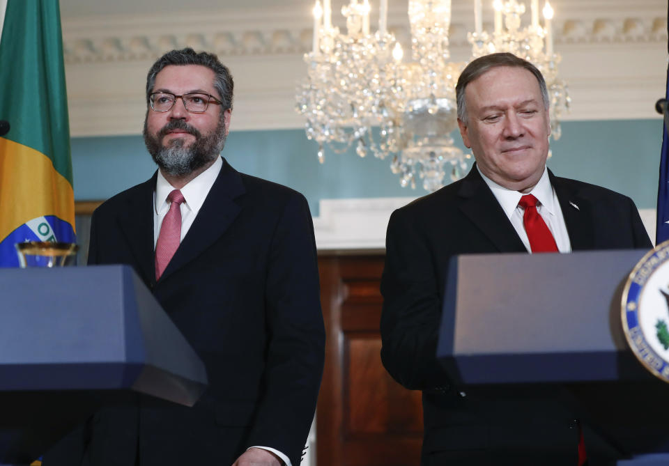 Secretary of State Mike Pompeo, right, and Brazilian Foreign Minister Ernesto Araujo, left, walk out to deliver remarks to members of the media at the Department of State in Washington, Friday, Sept. 13, 2019. (AP Photo/Pablo Martinez Monsivais)