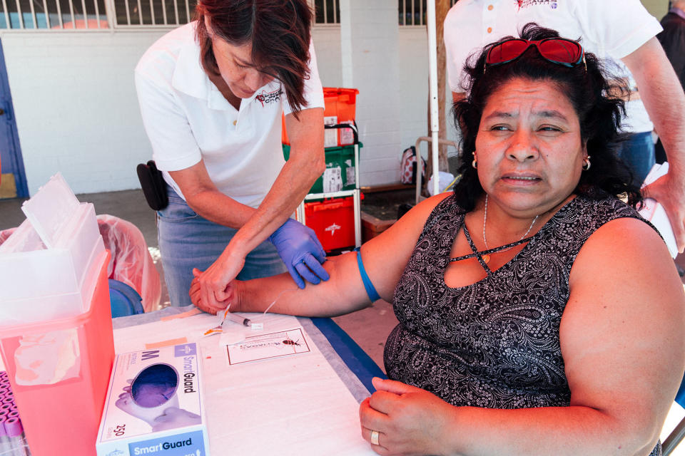 The Center of Excellence for Chagas Disease collects blood samples at an open-air festival for a community of people from Oaxaca, Mexico. The samples will be tested for Chagas disease. Most of the people who gave samples seemed not to have heard of Chagas before, despite coming from an area that puts them at high risk for the disease. (Photo: Angela Boatwright/DNDi)