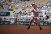 Russia's Anastasia Pavlyuchenkova stretches to return the ball to Kazakhstan's Elena Rybakina during their quarterfinal match of the French Open tennis tournament at the Roland Garros stadium Tuesday, June 8, 2021 in Paris. (AP Photo/Christophe Ena)