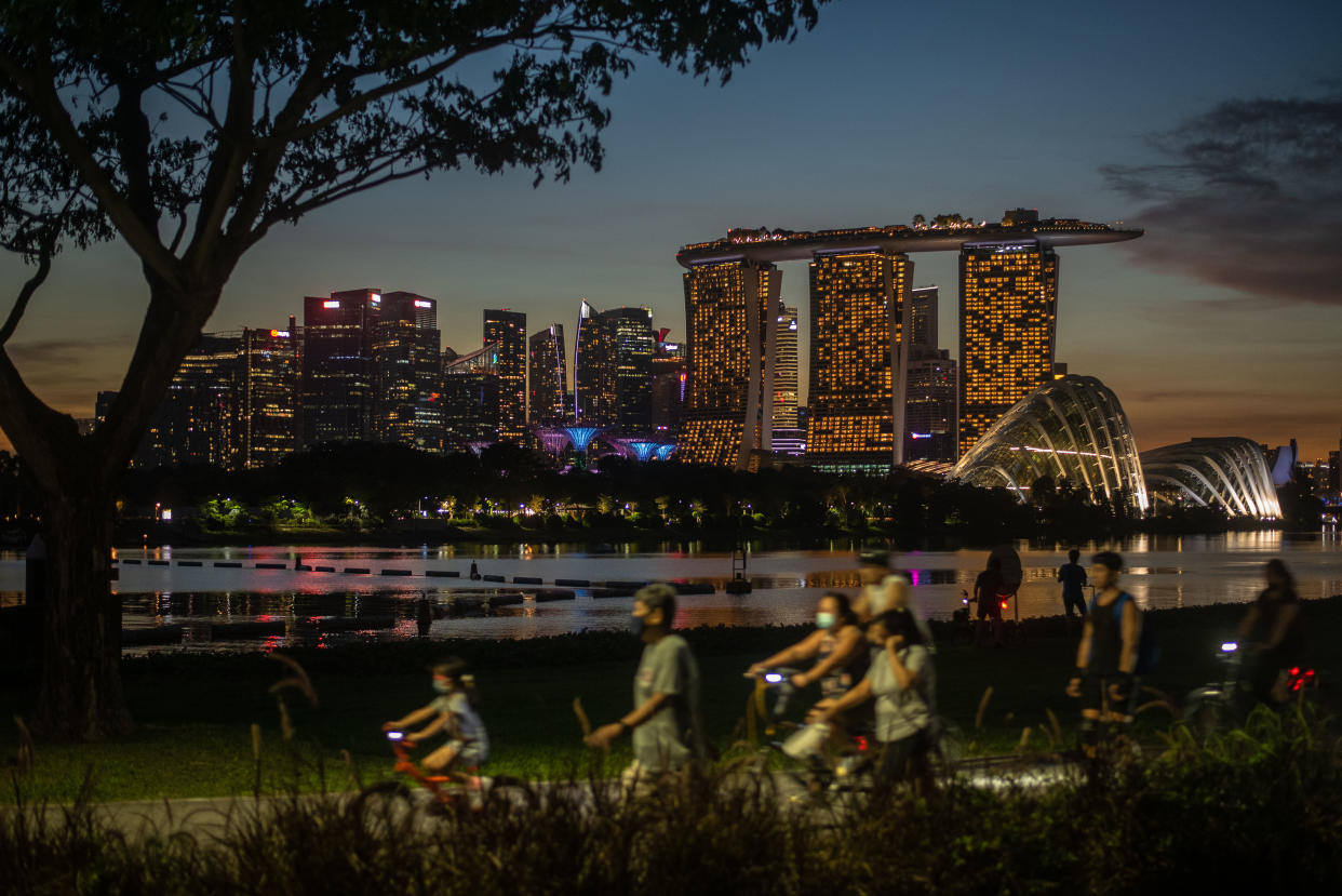 People cycle and walk after sunset in the Gardens by the Bay park in Singapore on Saturday, 6 November, 2021. (Photo by Joseph Nair/NurPhoto via Getty Images)