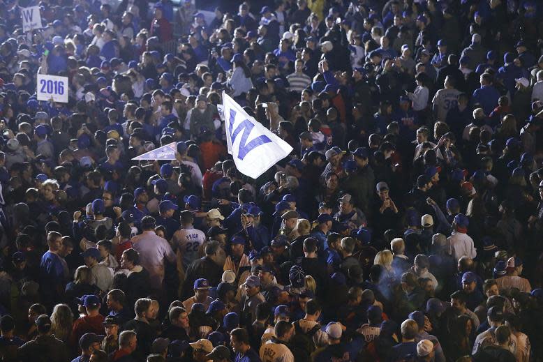 Cubs fans celebrate outside Wrigley Field after Game 6 of the NLCS. (AP)