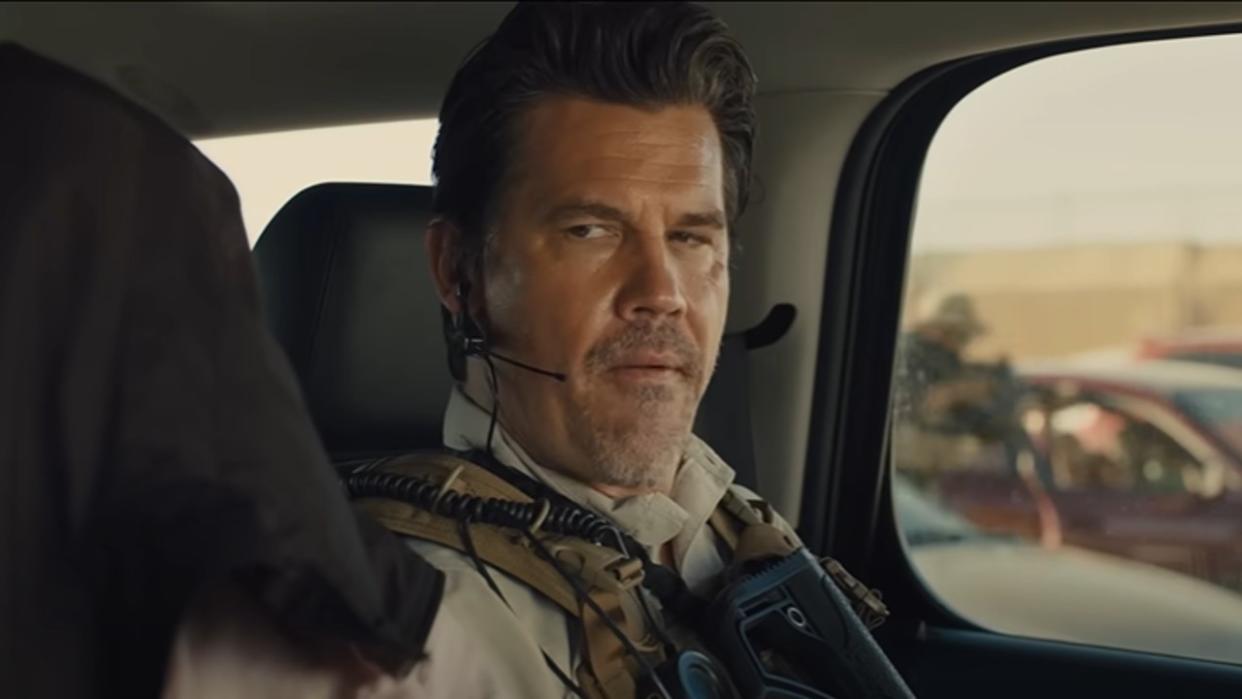  Josh Brolin sitting in a car in Sicario. 