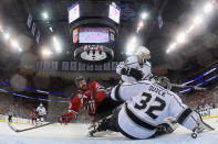 NEWARK, NJ - JUNE 02: David Clarkson #23 of the New Jersey Devils loses his balance in front of Jonathan Quick #32 and Drew Doughty #8 of the Los Angeles Kings during Game Two of the 2012 NHL Stanley Cup Final at the Prudential Center on June 2, 2012 in Newark, New Jersey. (Photo by Bruce Bennett/Getty Images)