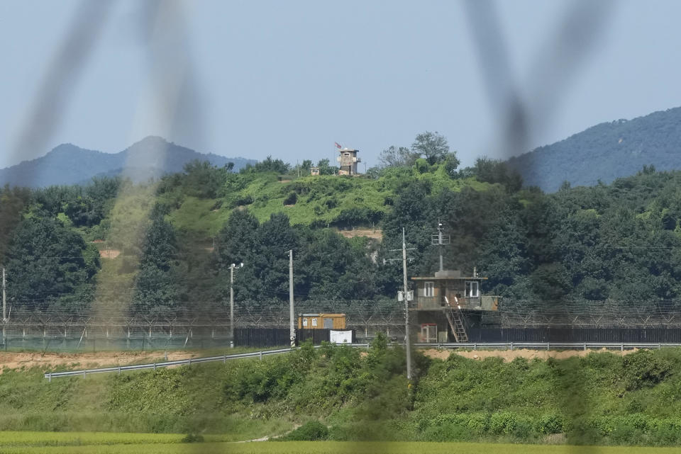 FILE - A North Korean military guard post, upper middle, and South Korean post, bottom, are seen from Paju, South Korea, near the border with North Korea, on Sept. 8, 2023. South Korea’s defense minister said Tuesday, Oct. 10, he would push to suspend a 2018 inter-Korean military agreement in order to resume frontline surveillance on rival North Korea, as the surprise attack on Israel by Hamas militants raised concerns in South Korea about similar assaults by the North. (AP Photo/Ahn Young-joon, File)