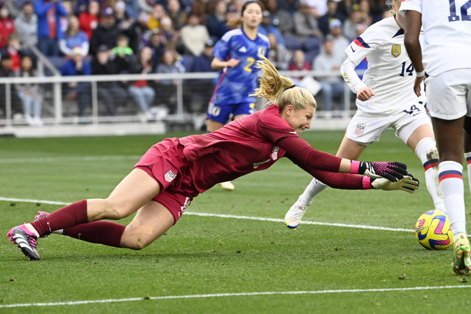 U.S. goalkeeper Casey Murphy (18) dives on the ball after blocking a shot by Japan during the second half of a SheBelieves Cup soccer match Sunday, Feb. 19, 2023, in Nashville, Tenn. The United States won 1-0. (AP Photo/Mark Zaleski)